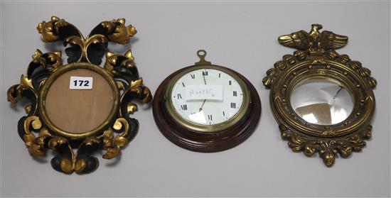 Two small circular mirrors and a clock face